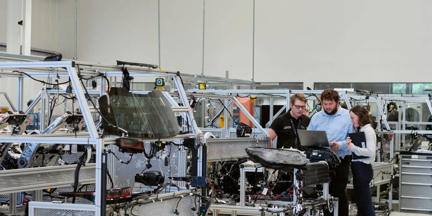 Illustrative engineering discussion beside a production system