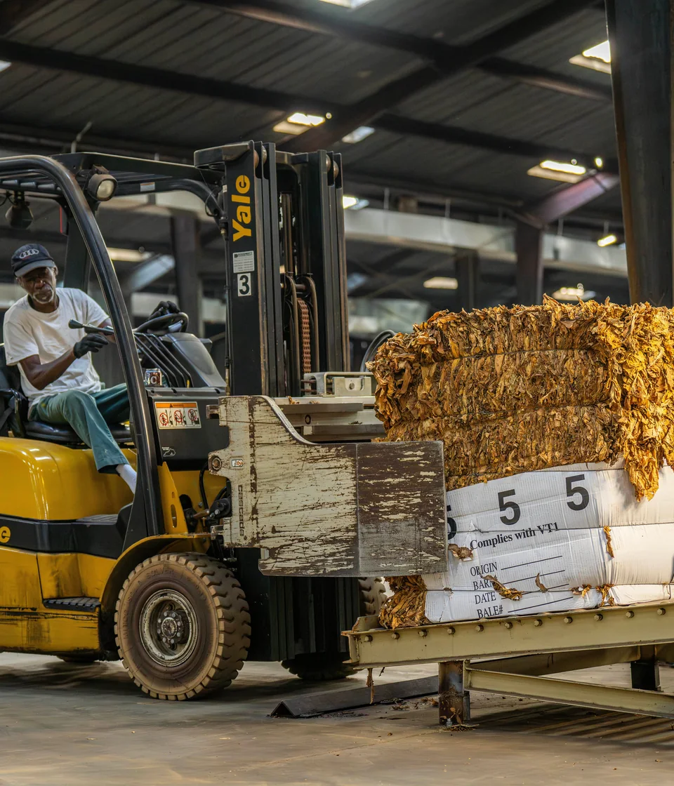 Illustrative forklift handling packaged industrial cargo